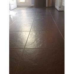 Black floor tiles. Approx 10sq meters