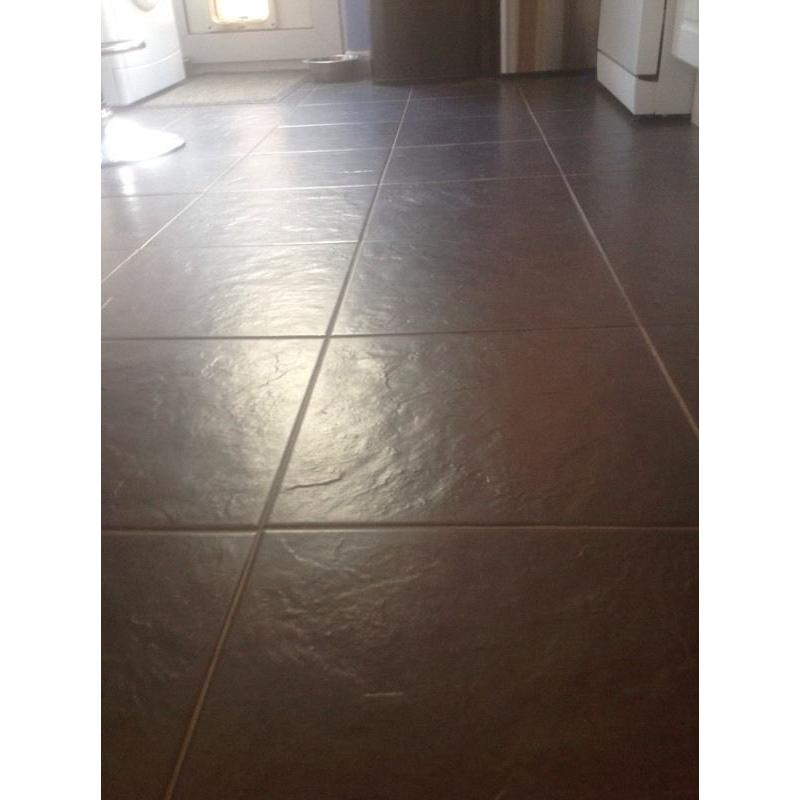Black floor tiles. Approx 10sq meters
