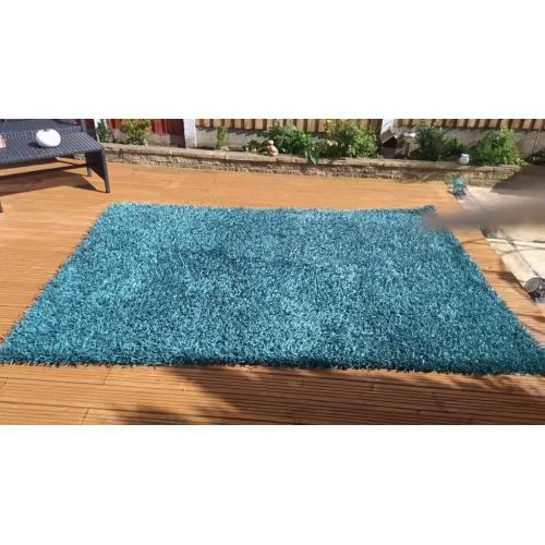 Teal shaggy rug