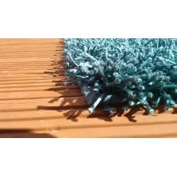 Teal shaggy rug