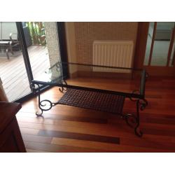 Large glass and ironwork coffee table