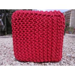 Orange knitted pouffe