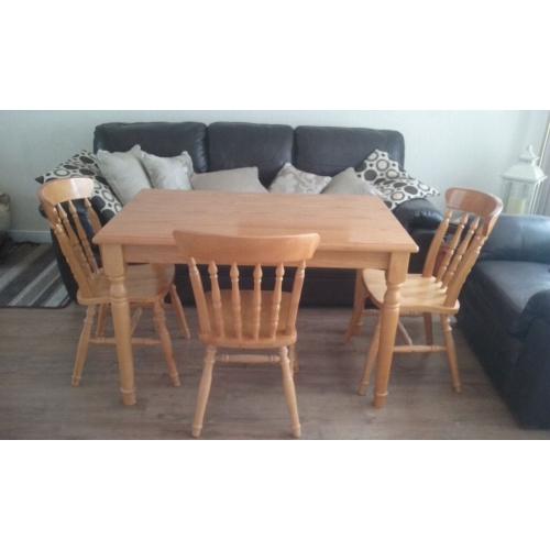 Pine kitchen table and 3 chairs.