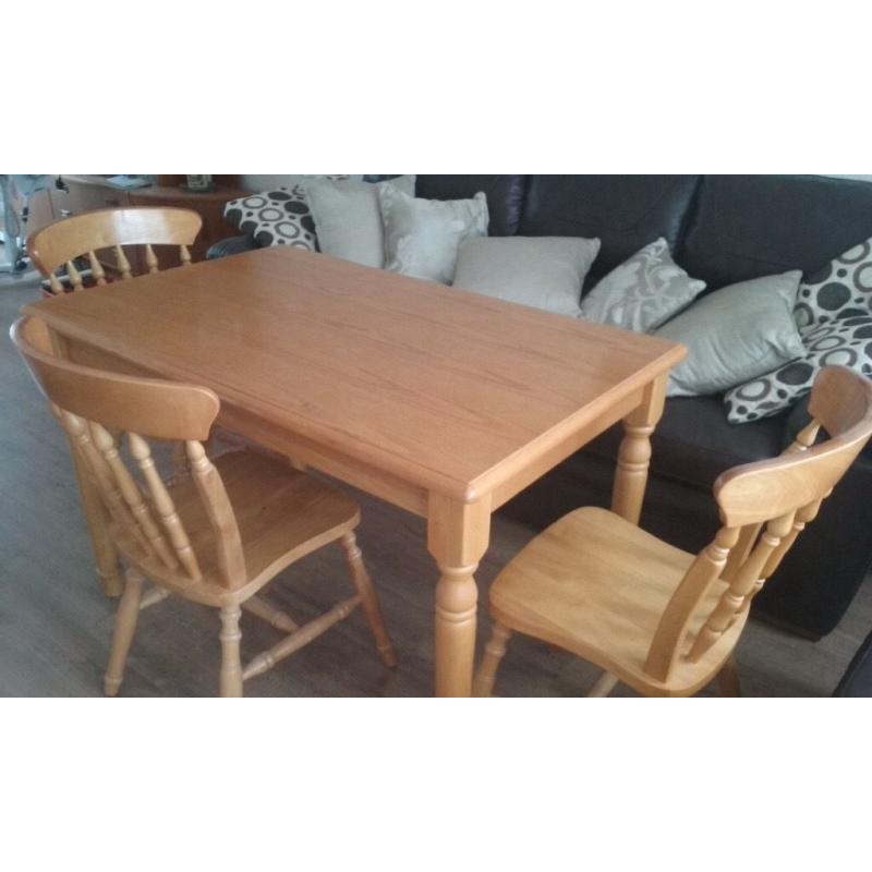 Pine kitchen table and 3 chairs.