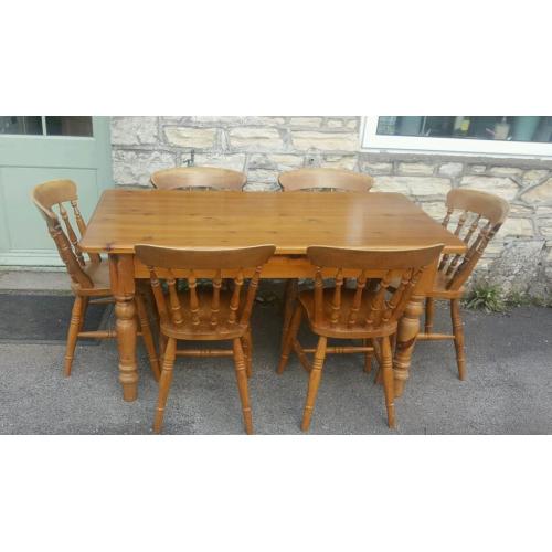 A solid pine dining table and 6 chairs (free local delivery)