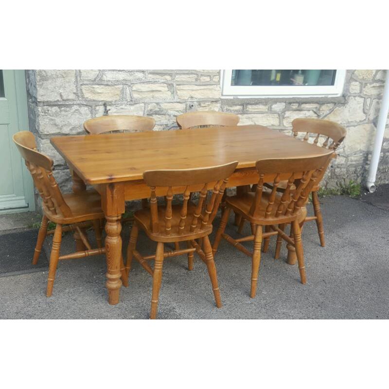 A solid pine dining table and 6 chairs (free local delivery)