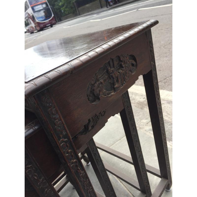 Nest of 4 Oriental tables , lovely carved detail , good condition. Must be seen.