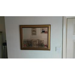 Gold framed wall mirror