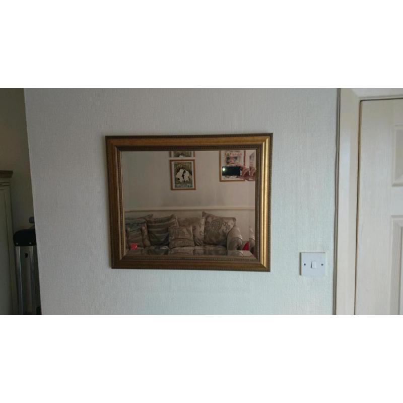Gold framed wall mirror