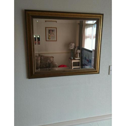 Gold framed wall mirror