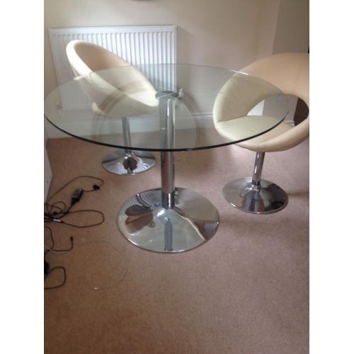 Round glass dining table with 4 chairs