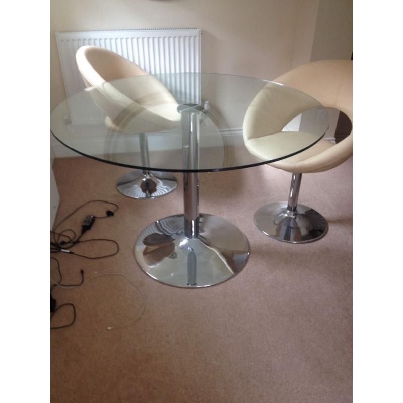 Round glass dining table with 4 chairs