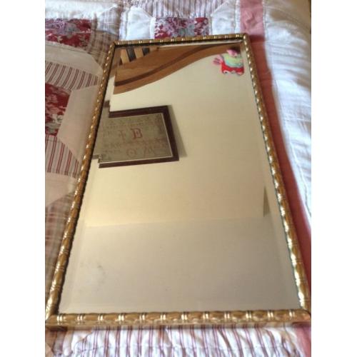 Gold scroll framed mirror