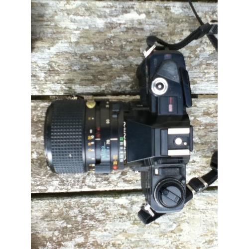 Mimolta X300 film camera with lens