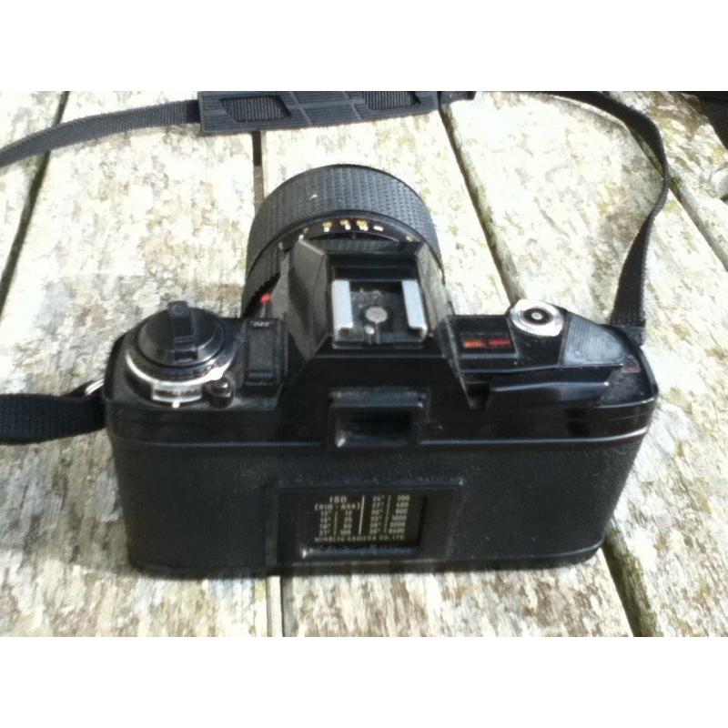 Mimolta X300 film camera with lens