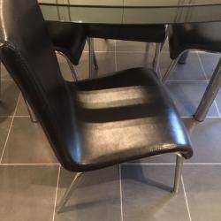 Glass dinning table and four chairs