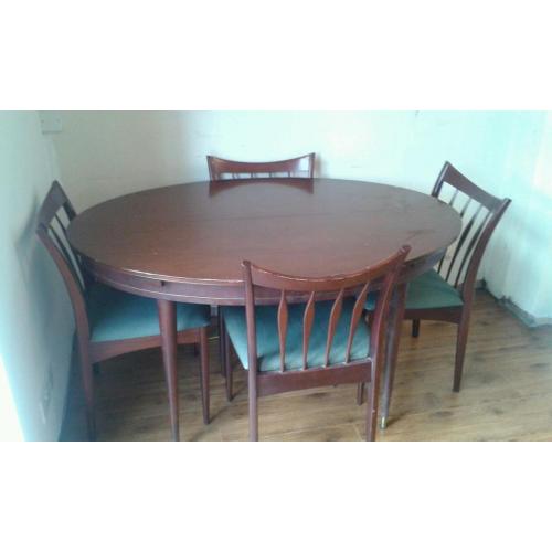 Solid wood extending dining table and 4 chairs.