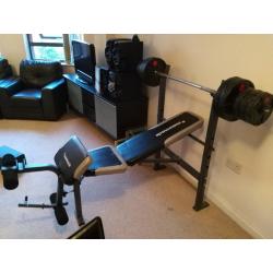 Multi-purpose bench, weights and bar for sale in Manchester.