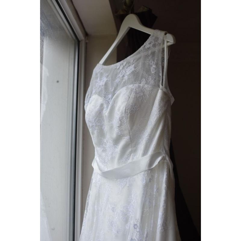 White wedding dress, size 14. Cleaned and comes with dress bag