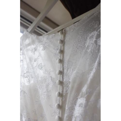 White wedding dress, size 14. Cleaned and comes with dress bag