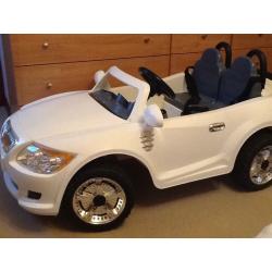 Childs 12v two seater car. White in colour.