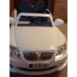 Childs 12v two seater car. White in colour.