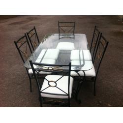GLASS TABLE WITH 6 CHAIRS.