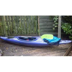 Kayak with skirt and paddle