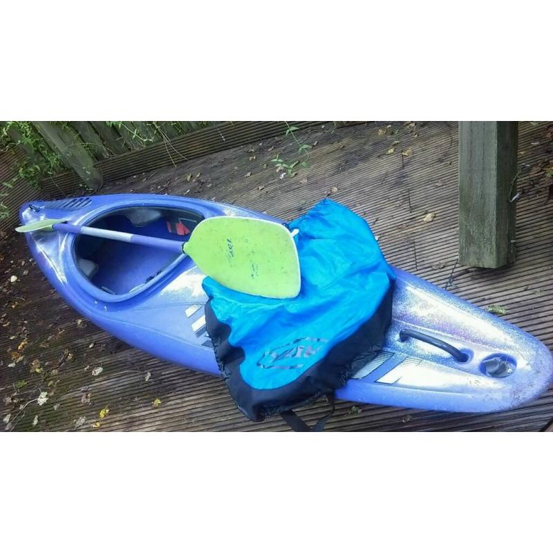 Kayak with skirt and paddle