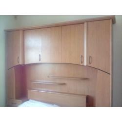 Overbed storage unit including double bed, drawers and cupboard