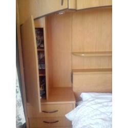 Overbed storage unit including double bed, drawers and cupboard