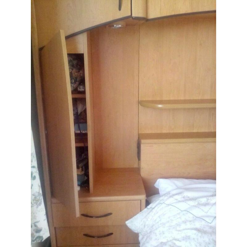Overbed storage unit including double bed, drawers and cupboard