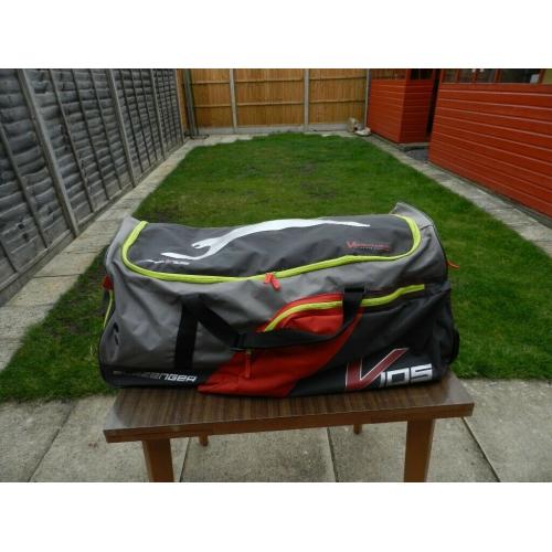 A Slazenger cricket bag with wheels