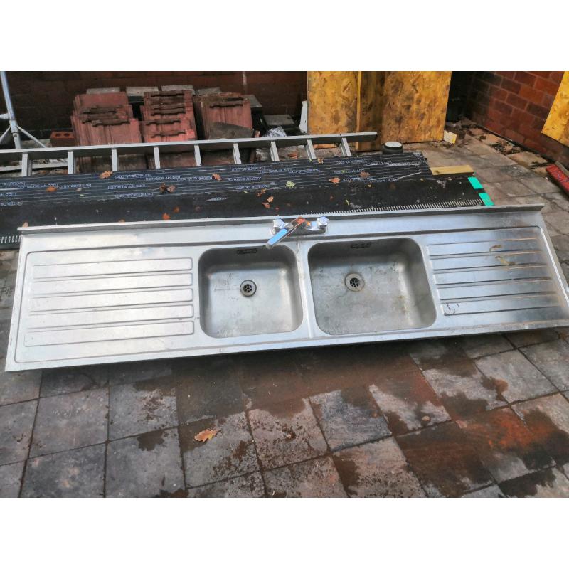Large double sink double drain with taps attached