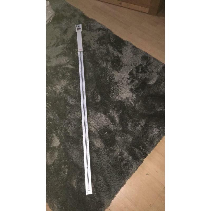 Wall mounted extendable height measure