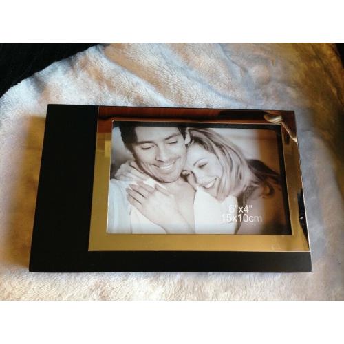 SILVER AND BLACK PHOTO FRAME NEW. PIC SIZES 15 CM BY 10 CM.
