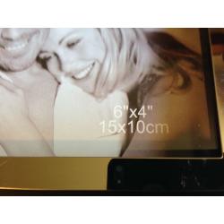 SILVER AND BLACK PHOTO FRAME NEW. PIC SIZES 15 CM BY 10 CM.