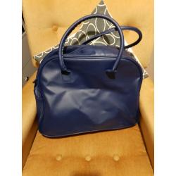 Fuzzy duck beauty products and overnight bag